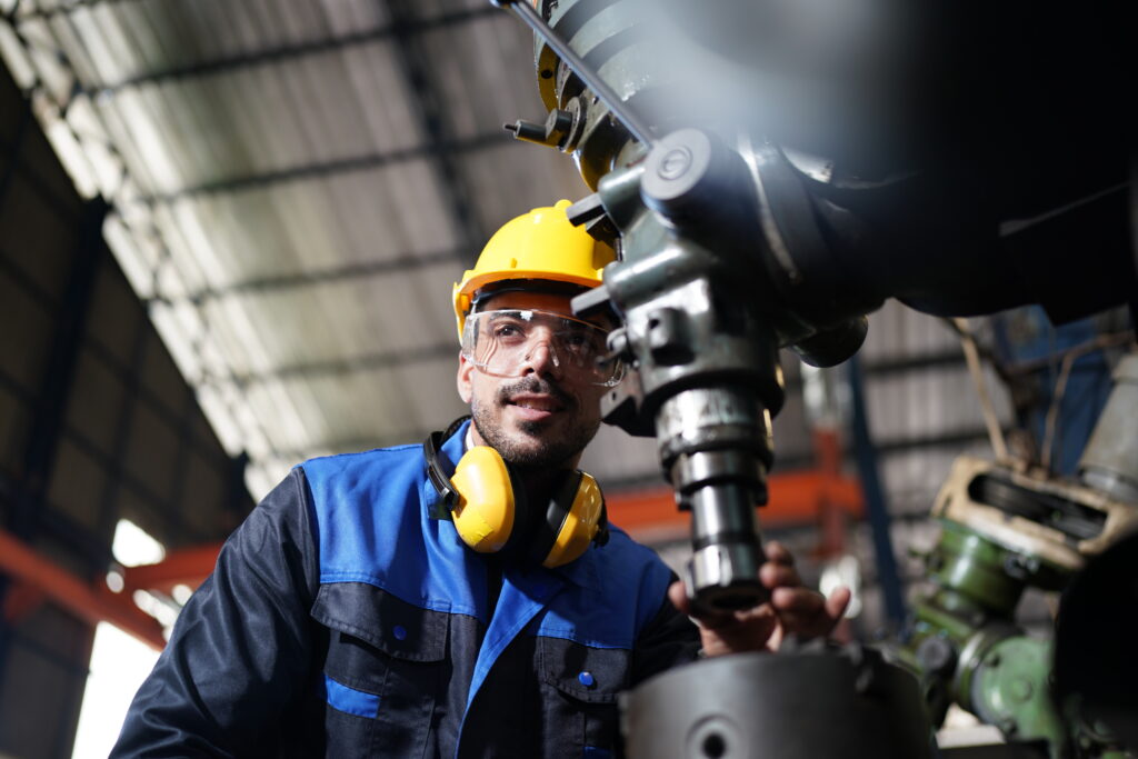 Engineer in a hard hat inspecting equipment
