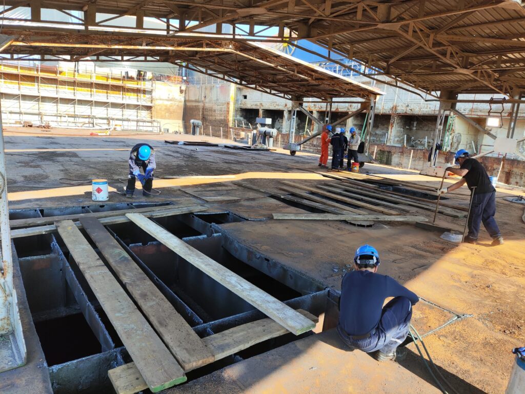 Specialists working on a steel deck section