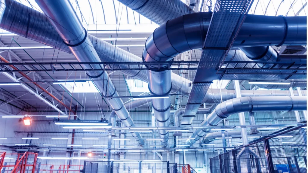Ventilation ducts and cable trays in an industrial hall