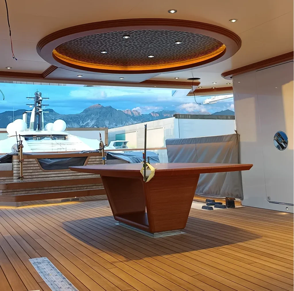 Teak deck with a helm table on a yacht